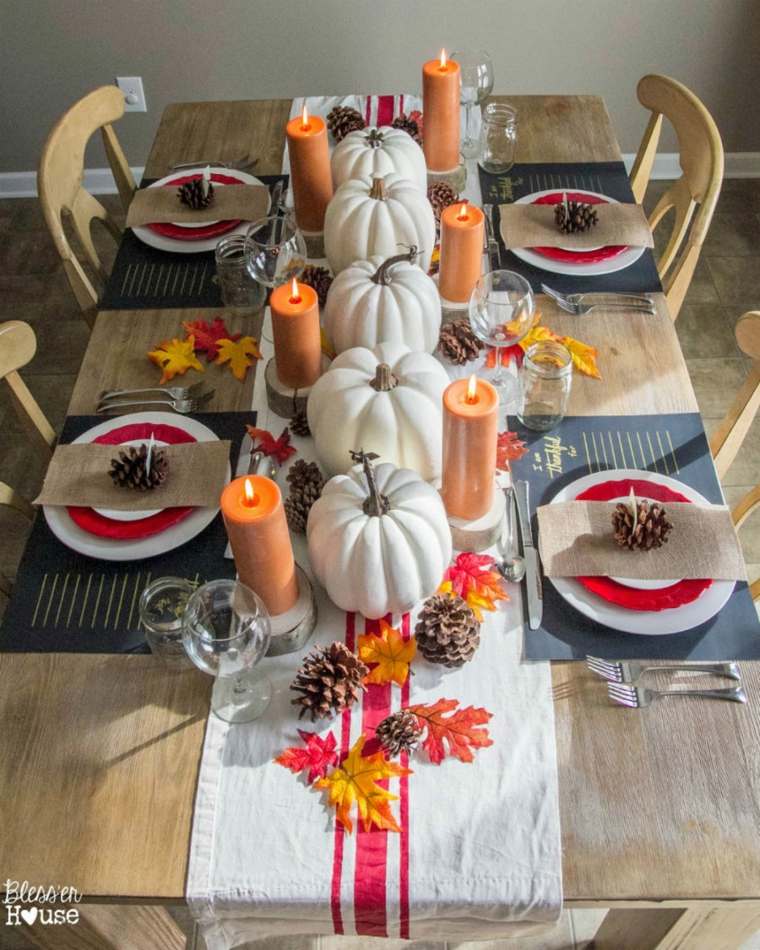 decorazione autunnale pigne candele zucche squash