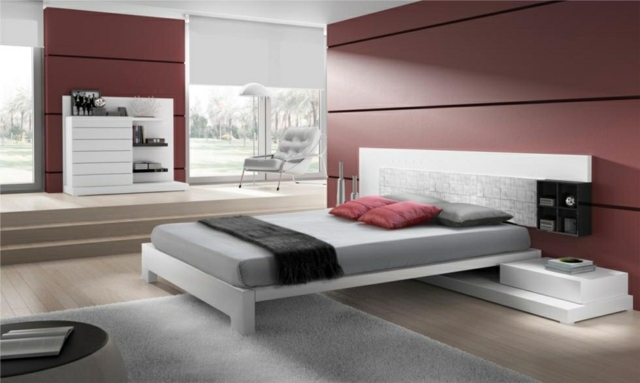 miegamojo dekoro idėjos-natūralios spalvos-raudonos sienos-kilimas-linas-lova-šviesiai pilkas miegamojo dekoravimo idėjos