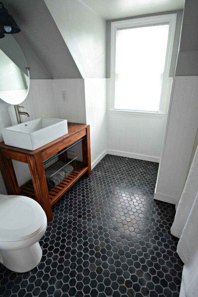 pavimento in piastrelle esagonali colore nero bianco bagno lavabo in legno mobile