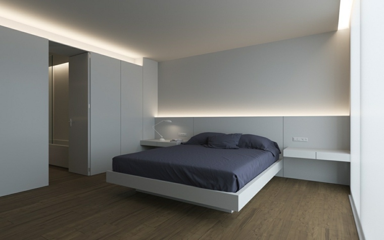 camera da letto minimalista testata luminosa idea cuscini letto parquet legno