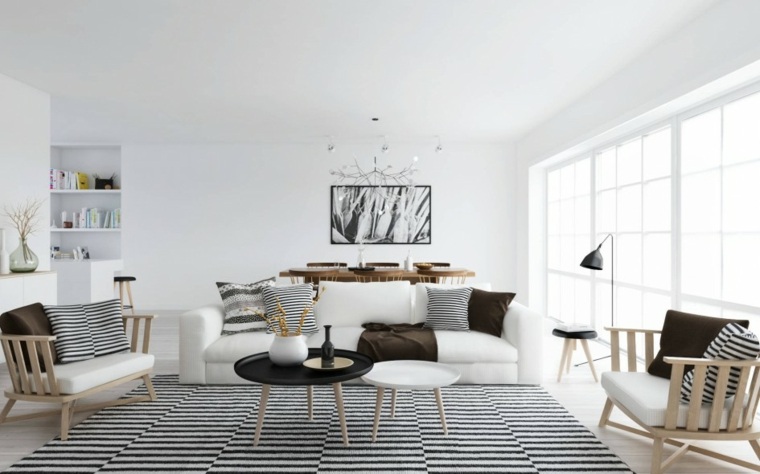 modernus interjero išdėstymas balta sofa juodas apvalus stalas sodo suoliuko sienų dekoras natūralios medžiagos
