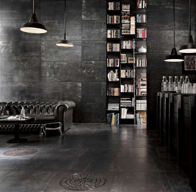 design moderno interni divano in pelle lampada sospensione libreria tendenza cemento