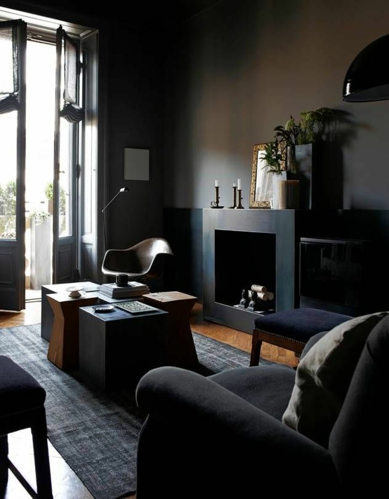 interni soggiorno moderno design grigio tappetino poltrona camino