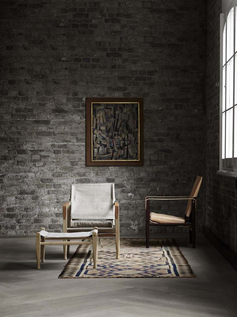 interni in stile nordico poltrona idea sedia tappetino da parete deco