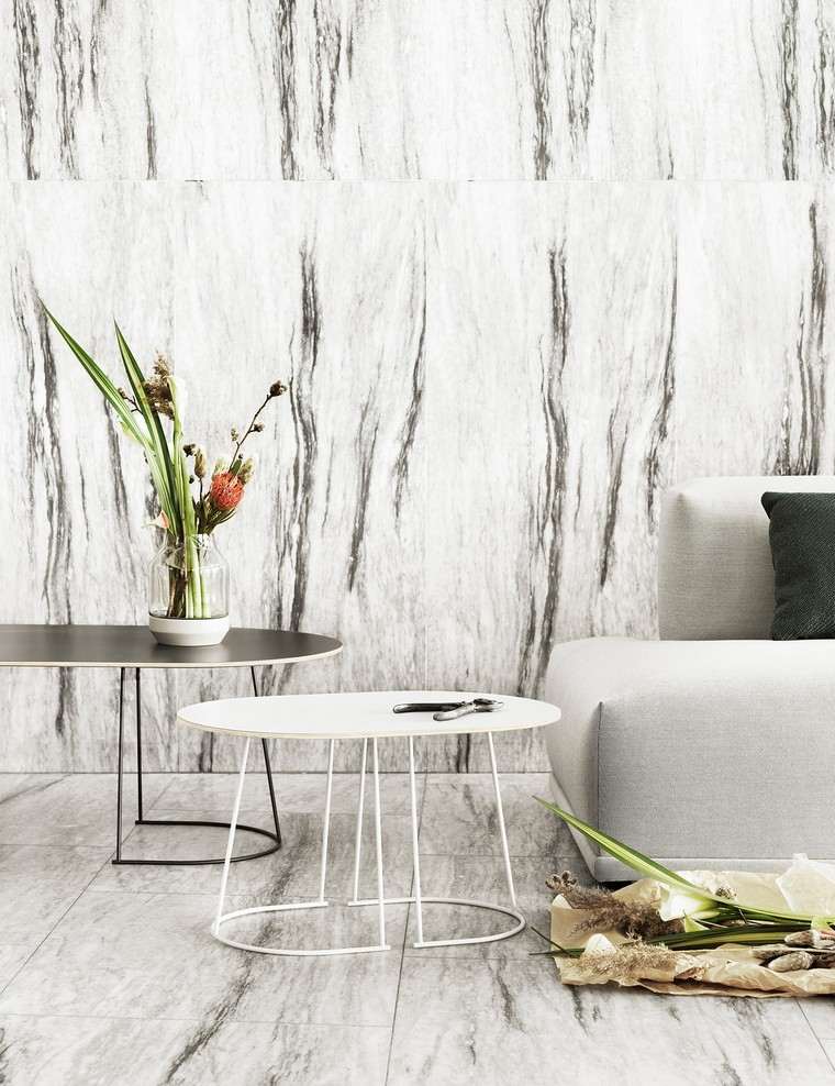 moderno stile scandinavo soggiorno divano grigio chiaro arredamento piante tavolino
