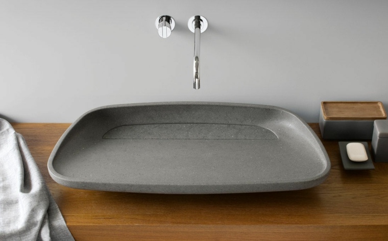 lavabo in pietra naturale moderno piano di lavoro in legno alla moda